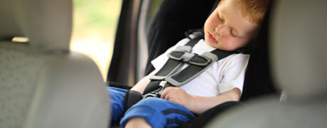 Boy sleeping in child car seat